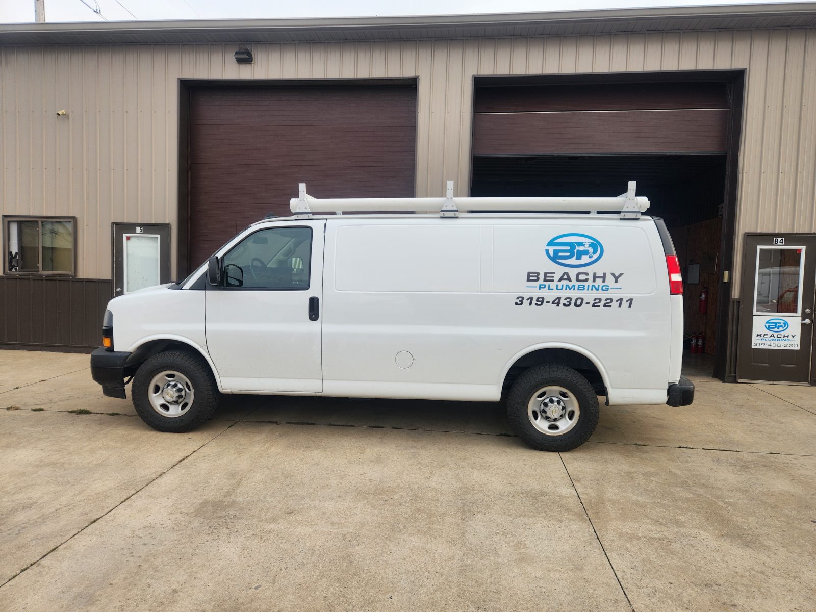 Beachy Plumbing work van outside the North Liberty shop